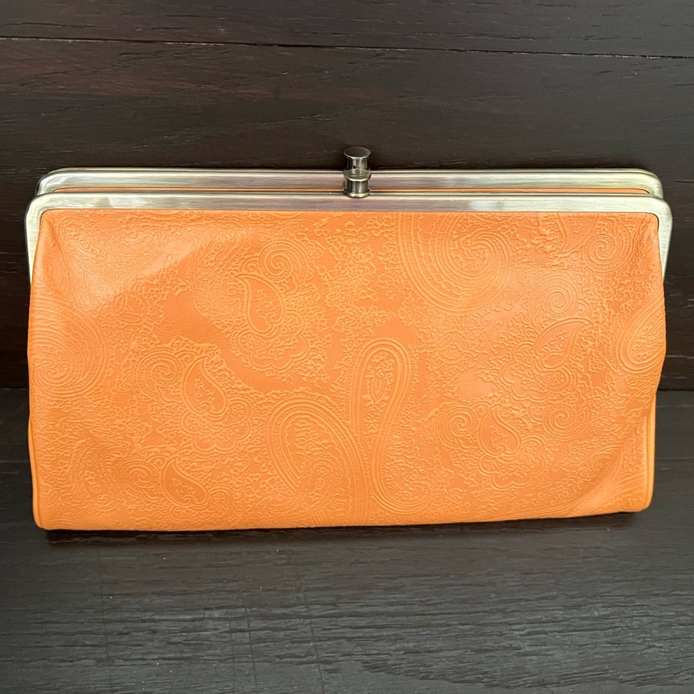Women’s Orange Hobo Clutch.  10.5 inches long and 6 inches tall.